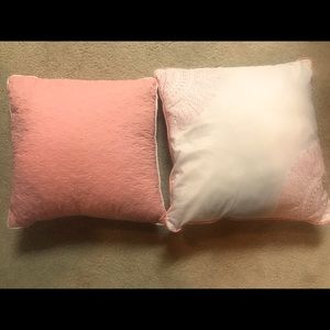 Set of two white snd coral decorative pillows